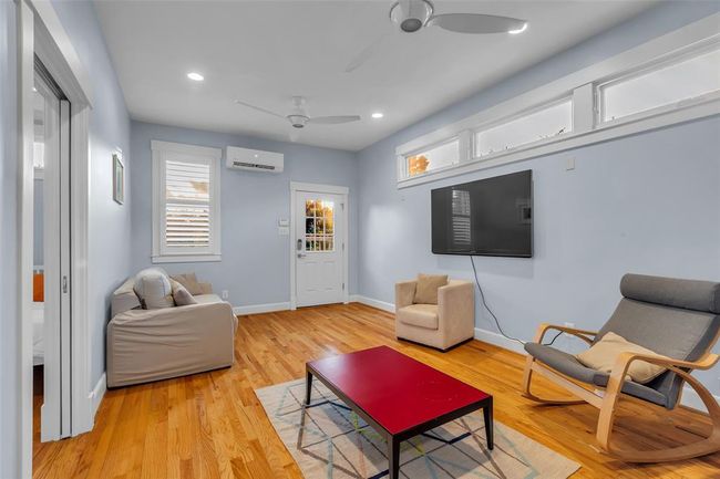 Charming garage apartment with a spacious, open living area. | Image 28