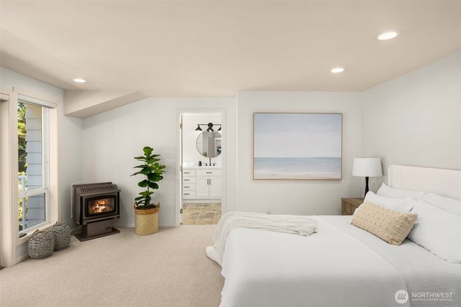 Serenity meets comfort in this dreamy bedroom — complete with glowing fireplace, garden views, and a luxurious ensuite just steps away. | Image 12