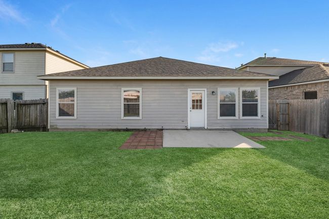 This backyard is perfect for family gatherings, social events, or simply unwinding in the fresh air. | Image 21