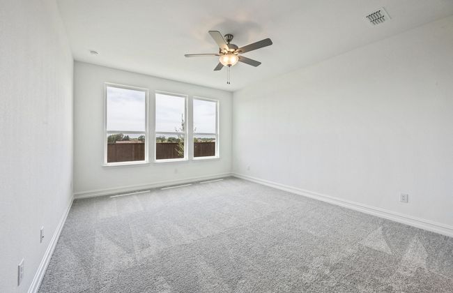 Owner's suite featuring large windows *Real home pictured | Image 11