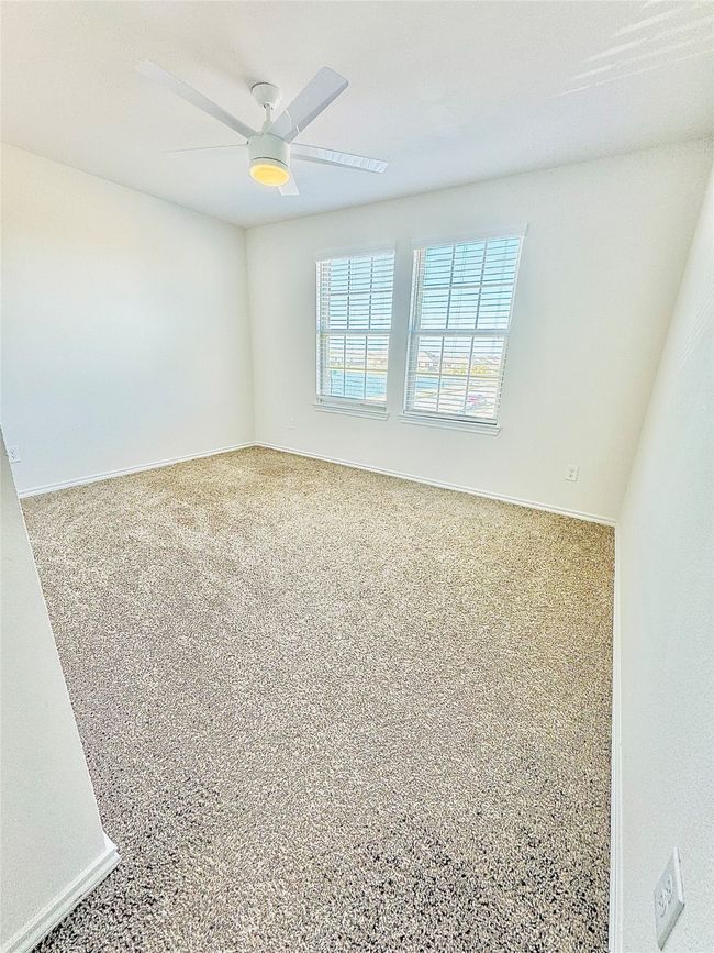 Spare room with baseboards and ceiling fan | Image 15