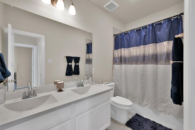 One of the upstairs full baths, which includes dual sinks. | Image 25