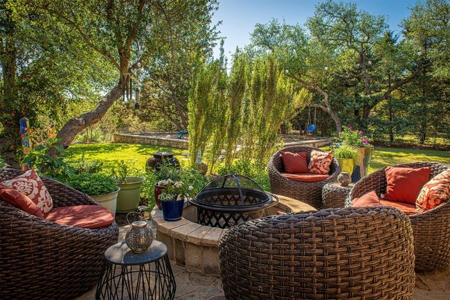 View of patio / terrace with a fire pit | Image 27