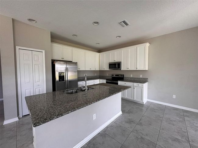 7309 Pool Compass Loop, House other with 4 bedrooms, 3 bathrooms and null parking in WESLEY CHAPEL FL | Image 6