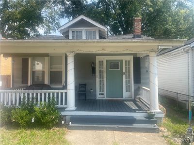 Bungalow featuring covered porch | Image 1