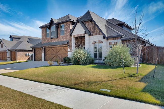 View of front of house with a front yard and 3 car garage | Image 7
