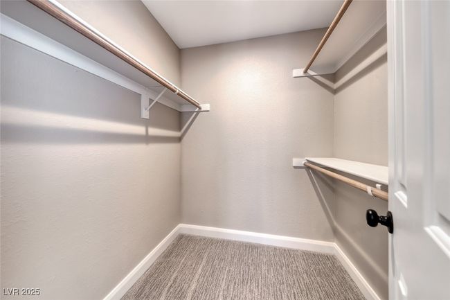 Spacious closet with carpet floors | Image 23