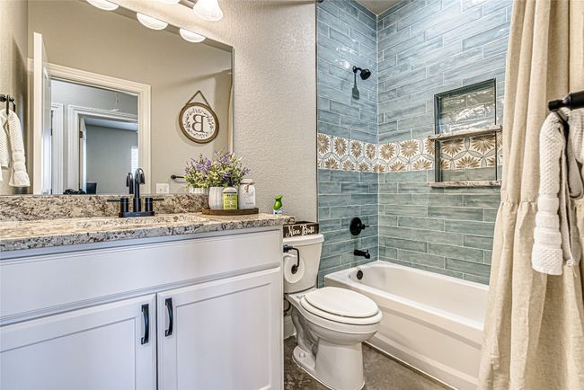 Full bath with shower/bath combination and beautiful decorative tile | Image 19