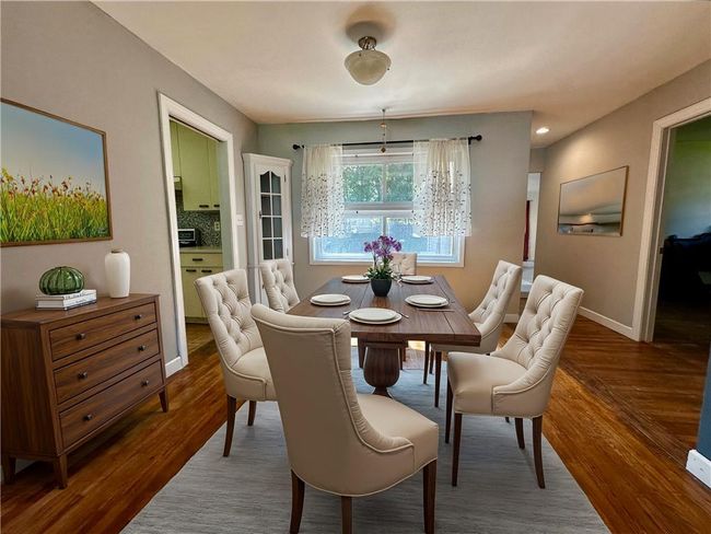 Virtually staged Dining room with wood-type flooring | Image 10