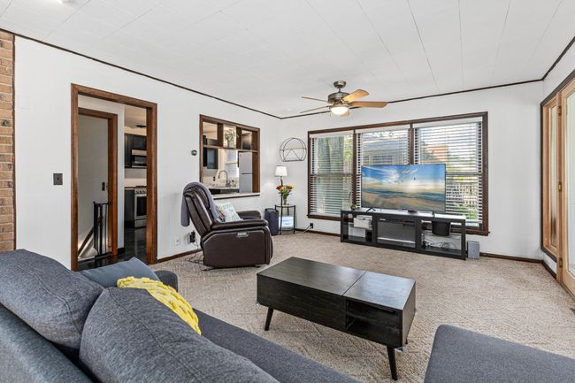 Family room is flooded with light from all four directions | Image 9