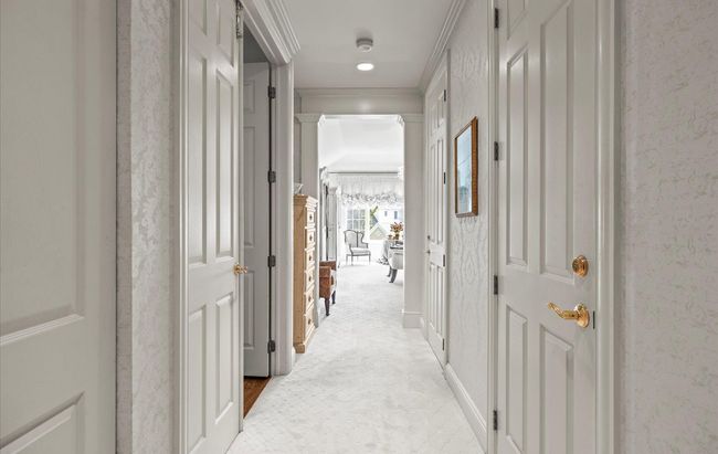 Hall featuring crown molding and light carpet | Image 21