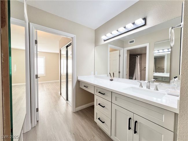 Bathroom and hallway to primary bedroom | Image 5