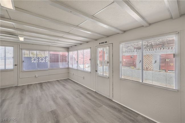 Unfurnished sunroom with beamed ceiling | Image 20