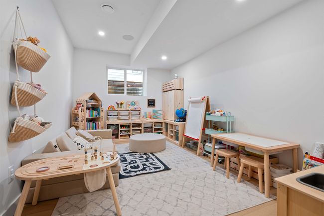 Recreation room with recessed lighting and light wood-style floors | Image 31