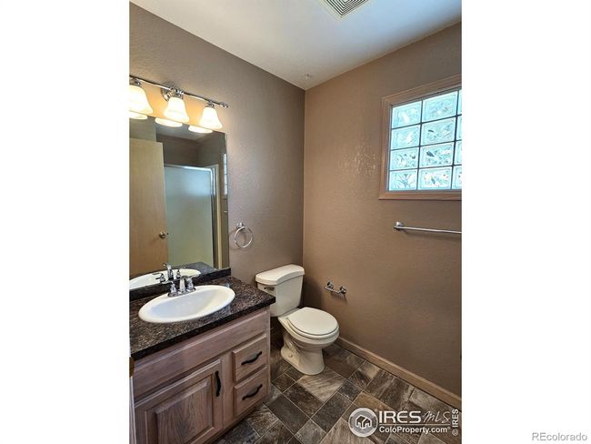 Main level 3/4 bath for guests conveniently located just inside from the garage door and across from the laundry | Image 14