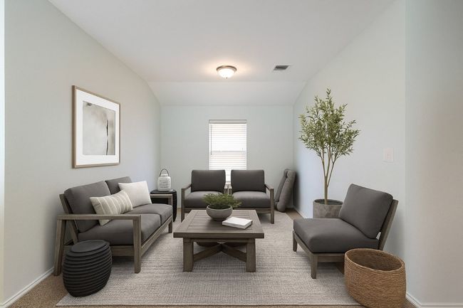Virtually Staged Carpeted living room with vaulted ceiling and baseboards | Image 37