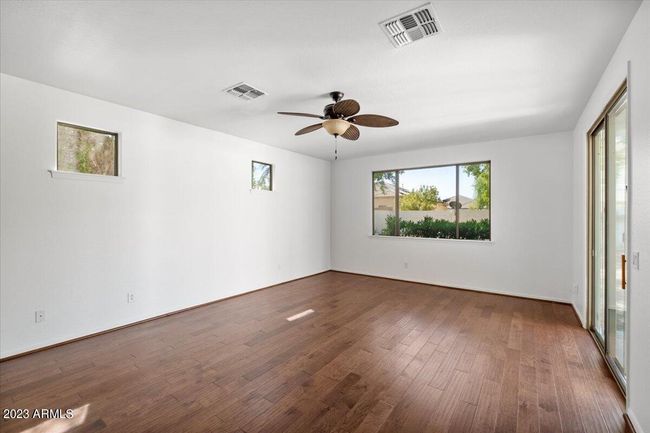 Lovely primary suite with lots of natural light, ceiling fan, and | Image 10