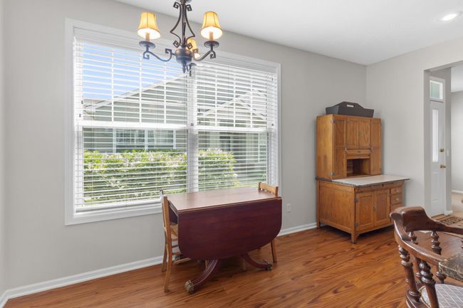 Spacious eating area filled with natural light and plenty of extra room to add shelving for cookbooks, your favorite plants and art pieces. | Image 25