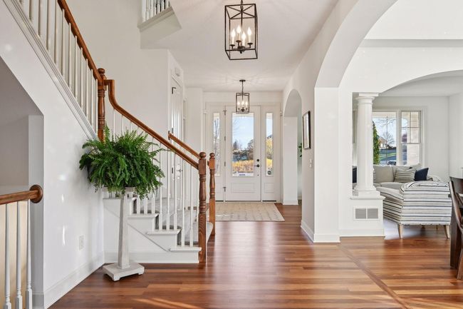 Entry with living room to the right and the office/main floor bedroom is to the left. | Image 4