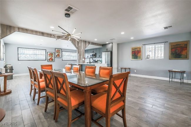 Dining area with wood finished floors, recessed lighting, and baseboards | Image 20