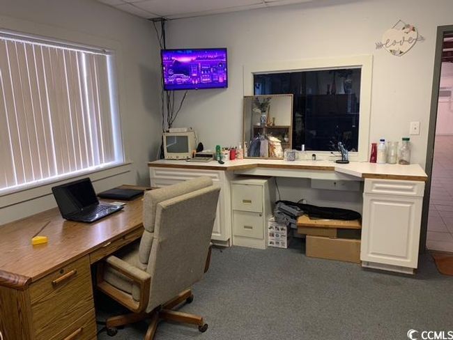 Carpeted office featuring a paneled ceiling | Image 30