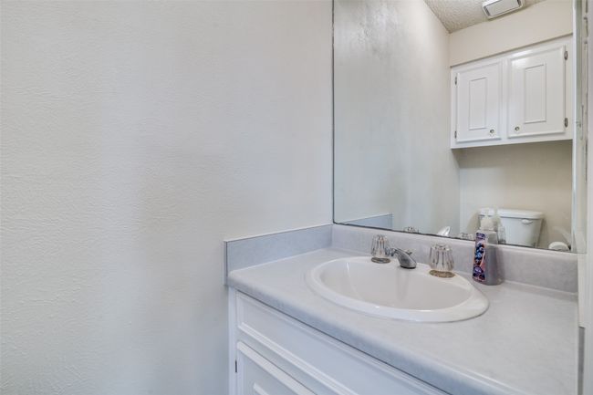 Bathroom with vanity and a textured ceiling | Image 21