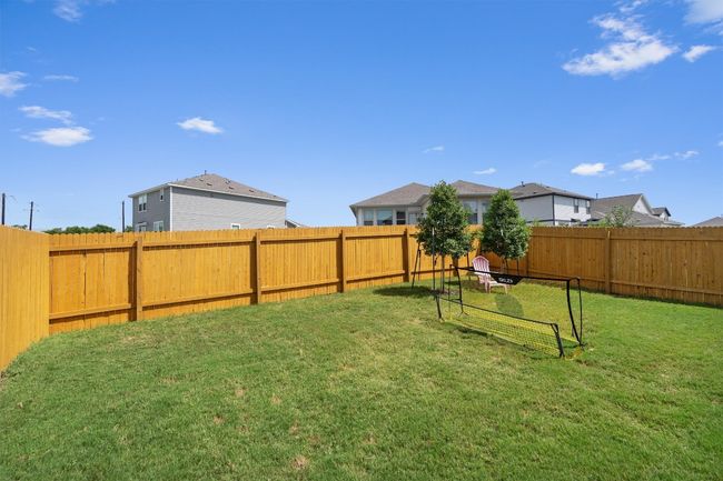 View of fenced backyard | Image 26