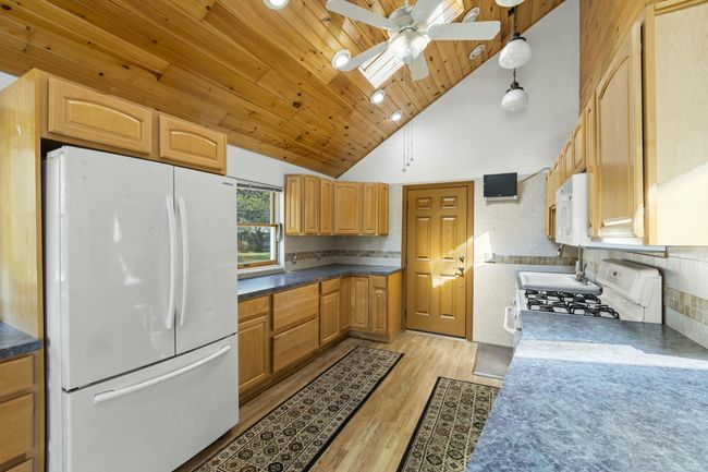 Kitchen. Door leads to Porch. | Image 8