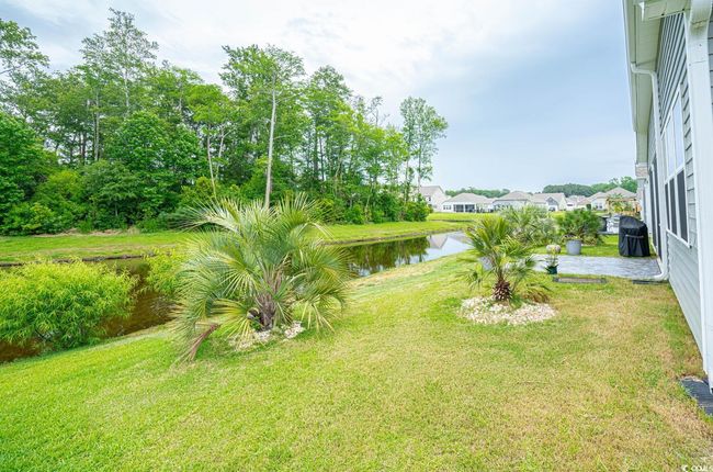 View of green lawn featuring a water view | Image 6