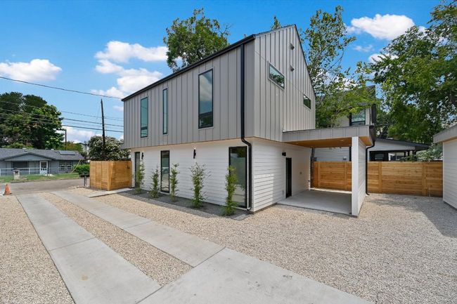 Contemporary home featuring board and batten siding | Image 7