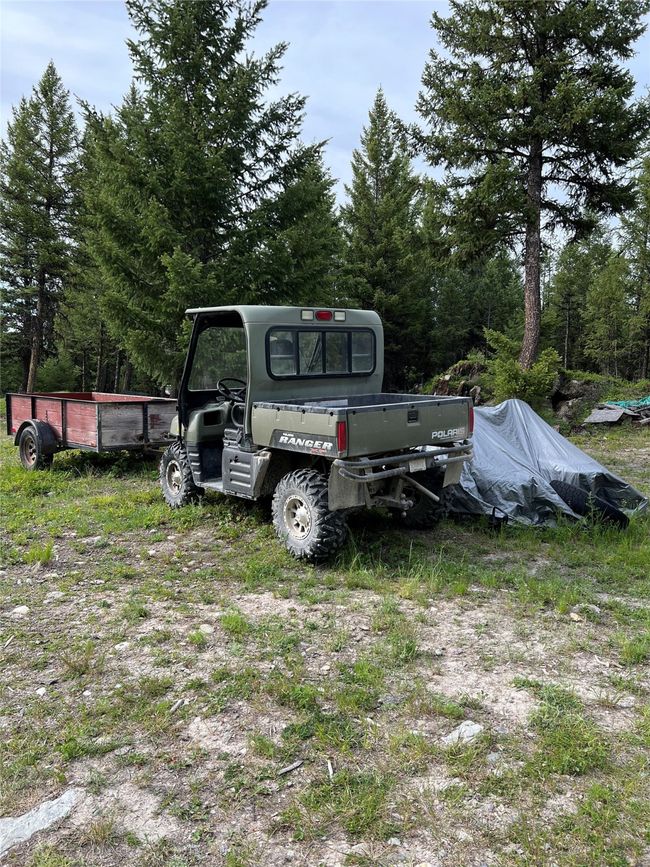 Polaris, snowmobiles, and utility trailer | Image 66
