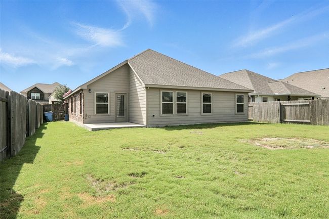 Back of property featuring a fenced backyard and a patio | Image 33