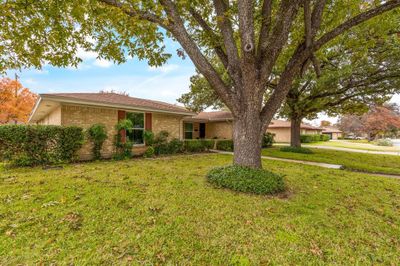 Single story full duplex featuring a front yard | Image 1