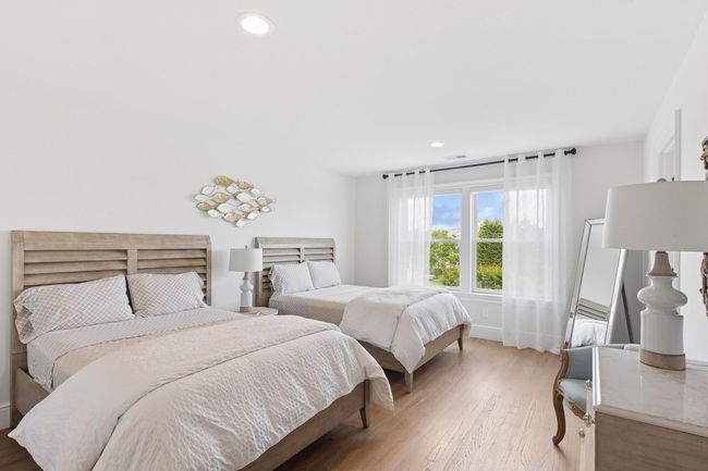 Bedroom with wood finished floors, baseboards, and recessed lighting | Image 16