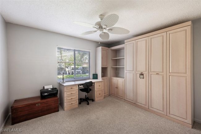 Office space featuring light carpet, a textured ceiling, and a ceiling fan | Image 14