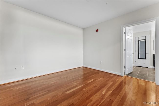 Unfurnished room featuring baseboards and wood finished floors | Image 31