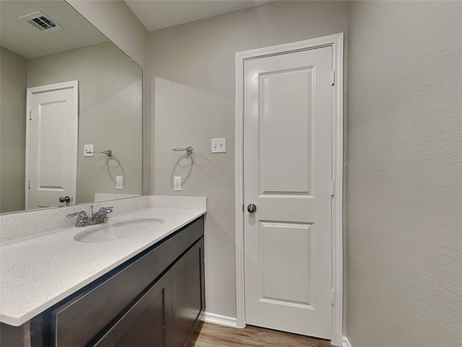 Bathroom featuring vanity, wood finished floors, and baseboards | Image 10