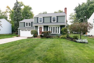 View of front of home with a garage and a front lawn | Image 3