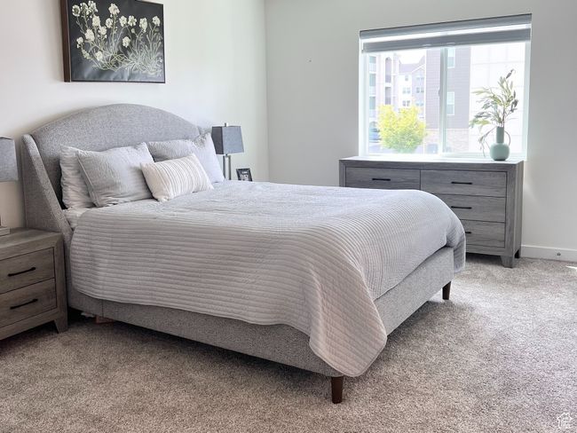 Bedroom with light carpet and a textured ceiling | Image 11