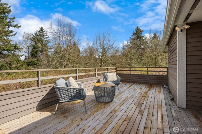 This sunny side deck off the kitchen/breakfast nook provides another great space for entertaining and enjoying the outdoors. | Image 18