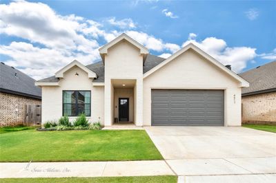 View of front of home with two care garage | Image 1