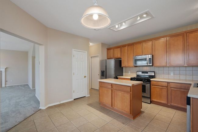 Kitchen featuring stainless steel appliances | Image 11
