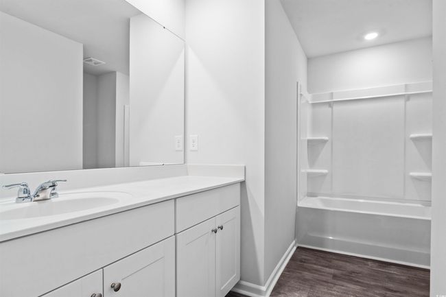 Unfurnished bedroom with visible vents, carpet flooring, and baseboards | Image 16