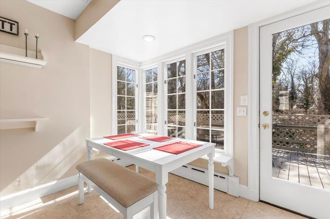 Sunroom / solarium featuring a baseboard heating unit | Image 11