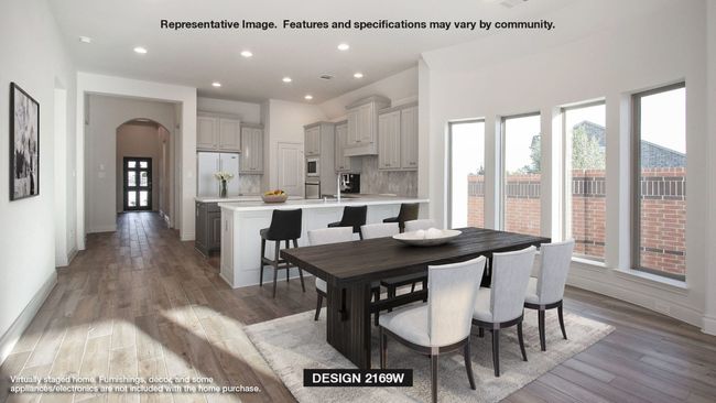 Dining room featuring recessed lighting, baseboards, light wood finished floors, visible vents, and arched walkways | Image 4