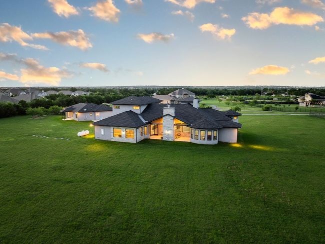 View of front of house with french doors and a front lawn | Image 28