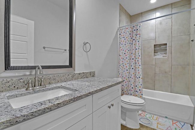 Bathroom 2 features granite countertops | Image 17