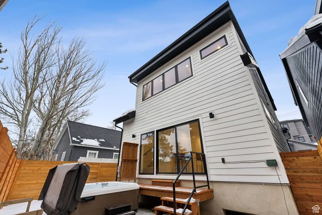 Back of house with a hot tub | Image 43