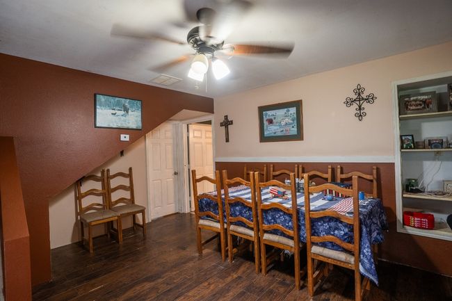 Dining space featuring ceiling fan and wood finished floors | Image 14