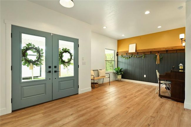 Entrance foyer with french doors, light LVP floors. | Image 11